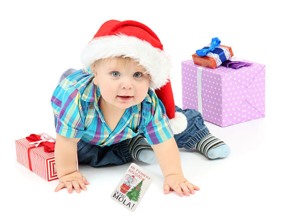 Little boy with gift, isolated on white